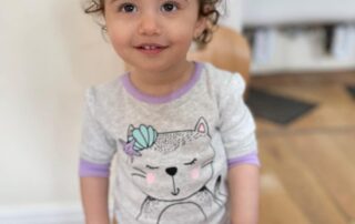 nursery child showing off pyjamas