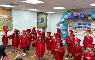 children celebrating graduation