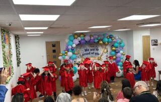 children celebrating their graduation