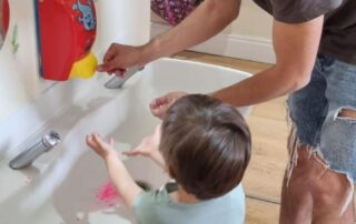 dad and son washing their hands