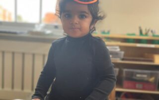 nursery child in a witches hat